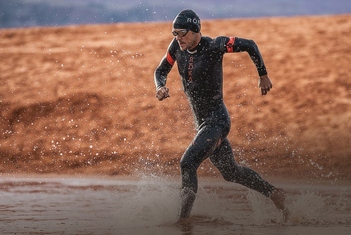 Tim Reed running into the water wearing the Maverick X2